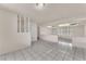 An airy living room boasts tile flooring and seamless transitions between the spaces for modern living at 2130 E Maule Ave, Las Vegas, NV 89119