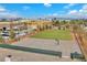 Image of a playground featuring a basketball court, track and field, and recreational facilities with buildings in the background at 2130 E Maule Ave, Las Vegas, NV 89119