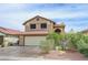 Charming two-story home featuring a red tile roof and well-maintained landscaping at 4808 Fiesta Lakes St, Las Vegas, NV 89130