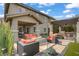 Outdoor living space with fire pit, covered patio, and desert landscaping at 5742 Shadow Bend Dr, Las Vegas, NV 89135