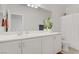 Clean bathroom with a white double sink vanity, large mirror, and a shower with a curtain at 5742 Shadow Bend Dr, Las Vegas, NV 89135