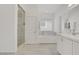 Bright bathroom featuring a soaking tub, frameless glass shower, and double sinks with marble countertops at 5742 Shadow Bend Dr, Las Vegas, NV 89135