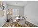 Bright breakfast nook with a round table, four chairs, and modern decor at 5742 Shadow Bend Dr, Las Vegas, NV 89135