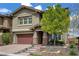 Charming two-story home boasts a well-manicured front yard, covered entry, and a two-car garage at 5742 Shadow Bend Dr, Las Vegas, NV 89135