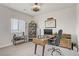 Bright office featuring a wooden desk, comfortable chair, and shelving for storage and decor at 5742 Shadow Bend Dr, Las Vegas, NV 89135