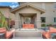 Covered patio with seating area with gas fire pit, and outdoor living space at 5742 Shadow Bend Dr, Las Vegas, NV 89135