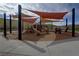 Community playground with slides, climbing features, and sun shades at 5742 Shadow Bend Dr, Las Vegas, NV 89135