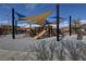 Community playground featuring slides and shade structures, perfect for Gathering fun and outdoor activities at 5742 Shadow Bend Dr, Las Vegas, NV 89135