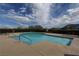 Community pool with clear blue water, providing a refreshing recreational amenity for residents at 5742 Shadow Bend Dr, Las Vegas, NV 89135
