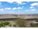 Scenic rooftop view of neighborhood homes and distant mountains under a bright blue sky at 5742 Shadow Bend Dr, Las Vegas, NV 89135