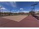 Well-maintained community tennis court with net, fencing, and court-side benches at 5742 Shadow Bend Dr, Las Vegas, NV 89135