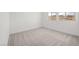 Bedroom with neutral walls and three sunny windows at 74 Via Montoro, Henderson, NV 89011