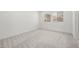 Bright bedroom featuring neutral walls and carpet and a bright window at 74 Via Montoro, Henderson, NV 89011