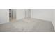 Neutral bedroom featuring neutral walls and carpet, with a view of the hallway at 74 Via Montoro, Henderson, NV 89011