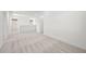 Bright bonus room boasts neutral carpet, and is adjacent to the staircase and hallway at 74 Via Montoro, Henderson, NV 89011