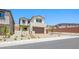Inviting two-story home with well-manicured landscaping and attached two-car garage at 74 Via Montoro, Henderson, NV 89011