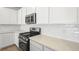 Close up view of kitchen featuring stainless steel appliances, white tile backsplash, and quartz counters at 74 Via Montoro, Henderson, NV 89011