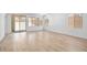 Spacious living area with wood-look flooring, sliding glass doors, and recessed lighting at 74 Via Montoro, Henderson, NV 89011