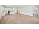 Bright, open-concept living space features wood-look flooring and natural light at 74 Via Montoro, Henderson, NV 89011