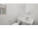 Clean powder room with a pedestal sink, oval mirror, and natural light at 74 Via Montoro, Henderson, NV 89011