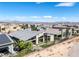 Aerial view of contemporary homes, desert landscaping, and mountain views at 10271 Meridian Hill Ave, Las Vegas, NV 89135