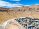 Community aerial view with desert surroundings and organized street layout at 10271 Meridian Hill Ave, Las Vegas, NV 89135
