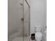 Modern bathroom showcasing a glass enclosed shower, and ceramic toilet at 10271 Meridian Hill Ave, Las Vegas, NV 89135