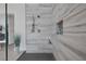 Modern bathroom showcasing a spacious, tiled shower with dual shower heads and built-in niche at 10271 Meridian Hill Ave, Las Vegas, NV 89135
