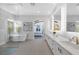 Bright bathroom features a walk-in shower, soaking tub, and double vanity with modern fixtures and ample storage at 10271 Meridian Hill Ave, Las Vegas, NV 89135