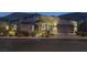 Modern home with gray exterior paint, blue door, desert landscaping, and mountain views at 10271 Meridian Hill Ave, Las Vegas, NV 89135