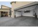 Open garage showcases epoxy flooring, ample storage cabinets, and overhead storage racks at 10271 Meridian Hill Ave, Las Vegas, NV 89135