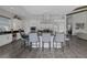 Spacious kitchen features a large island with bar seating, stainless steel appliances, and sleek countertops at 10271 Meridian Hill Ave, Las Vegas, NV 89135