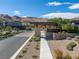 Stone-clad Nova Ridge community entrance with desert landscaping at 10271 Meridian Hill Ave, Las Vegas, NV 89135