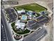 Comprehensive aerial view of Skye Canyon Park featuring a pool, sports field, splash pad and fitness center at 10631 Sariah Skye Ave, Las Vegas, NV 89166