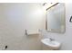 Stylish powder room featuring geometric wallpaper and modern fixtures at 10631 Sariah Skye Ave, Las Vegas, NV 89166
