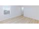 Bedroom with wood flooring and a window offering natural light at 10631 Sariah Skye Ave, Las Vegas, NV 89166