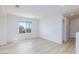 Well-lit bedroom with views of the outdoors and wood-style flooring at 10631 Sariah Skye Ave, Las Vegas, NV 89166