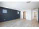 Well-lit room featuring modern design and durable wood-look floors at 10631 Sariah Skye Ave, Las Vegas, NV 89166