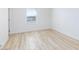 Bright bedroom with new wood flooring and a window with a view at 10631 Sariah Skye Ave, Las Vegas, NV 89166
