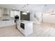 Modern kitchen features marble countertops, island with pendant lighting, and stainless steel appliances at 10631 Sariah Skye Ave, Las Vegas, NV 89166