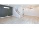 Open floor plan features staircase with modern railing, luxury vinyl floors, and recessed lighting at 10631 Sariah Skye Ave, Las Vegas, NV 89166