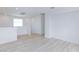 Spacious living area featuring modern lighting and wood-look floors at 10631 Sariah Skye Ave, Las Vegas, NV 89166