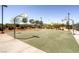 Outdoor basketball court with multiple hoops and well-maintained green surface for recreational play at 1072 Pennyfeather Rd, Henderson, NV 89015