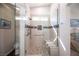 Walk-in shower featuring tile and bench seating at 1072 Pennyfeather Rd, Henderson, NV 89015