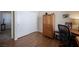 Bedroom showing wood floors, a closet, and a desk, creating a comfortable and functional space at 1072 Pennyfeather Rd, Henderson, NV 89015