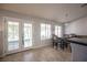 Charming dining area with natural light from backyard access and backyard views at 1072 Pennyfeather Rd, Henderson, NV 89015