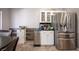 Bright dining area with stainless steel refrigerator, natural light, and tiled flooring at 1072 Pennyfeather Rd, Henderson, NV 89015