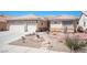 Charming single-story home with xeriscaping, desert plants, and a spacious two-car garage at 1072 Pennyfeather Rd, Henderson, NV 89015