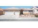 Charming single-story home with a two-car garage and desert landscaping at 1072 Pennyfeather Rd, Henderson, NV 89015