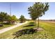 Lush, green grassy park area with walking paths and mature shade trees at 1072 Pennyfeather Rd, Henderson, NV 89015